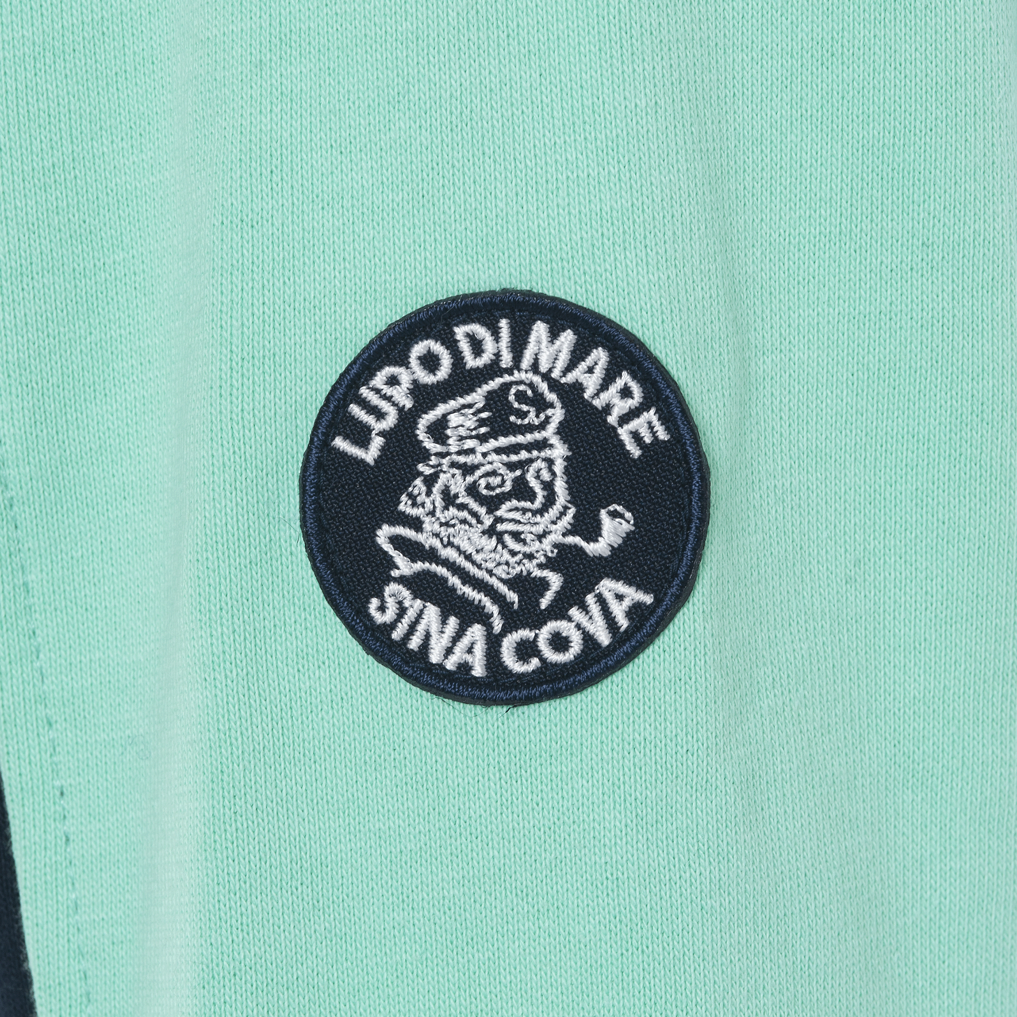 【公式】シナコバ (SINA COVA) ZIPUPプルオーバー 22210030 ネイビーの小丸ワッペン