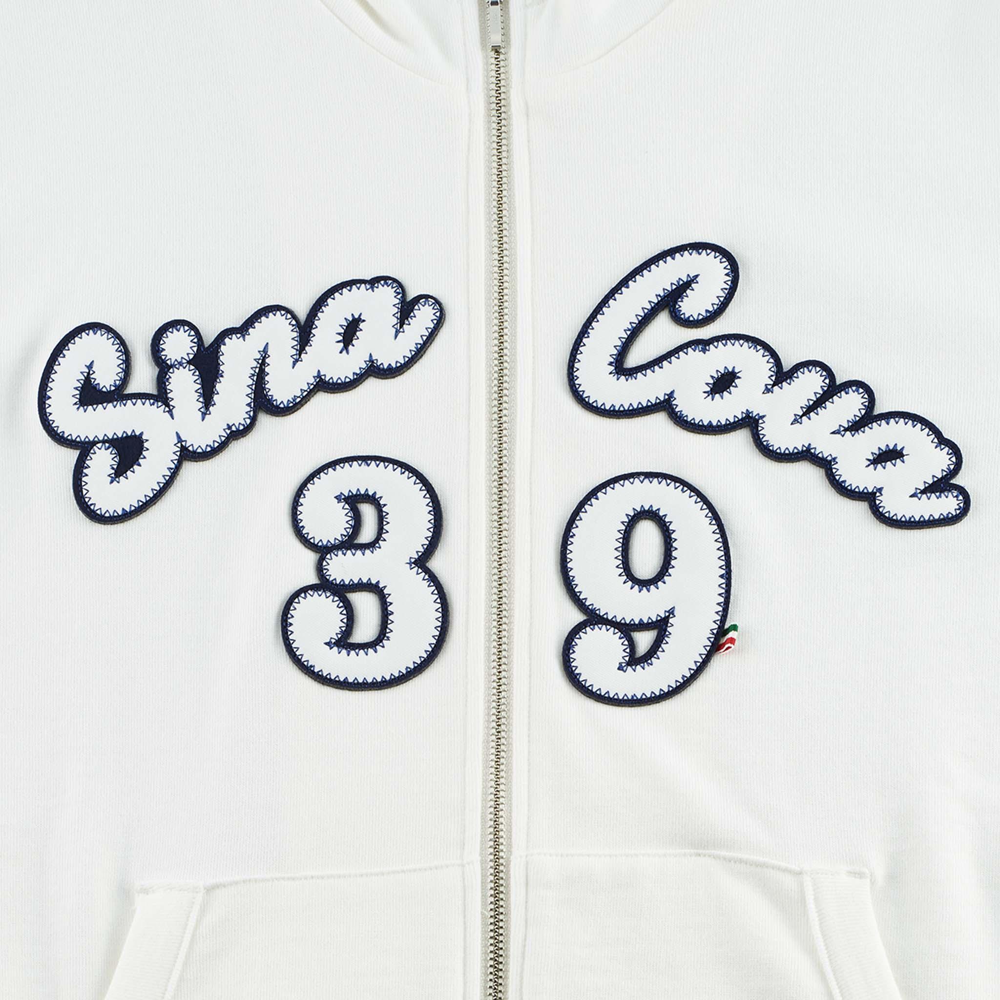 【公式】シナコバ (SINA COVA) ZIPUPパーカー 22123010 ホワイトのワッペン部分